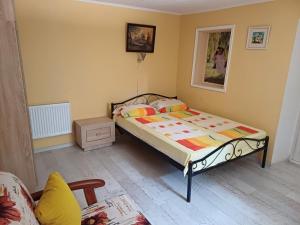 a bedroom with a bed in a room at House with flowers in Sanzhiyka