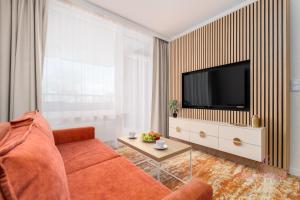 Your Holidays Bel Mare 107 Fにあるテレビまたはエンターテインメントセンター