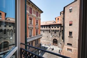 a view of a city from a window at Art Hotel Orologio in Bologna