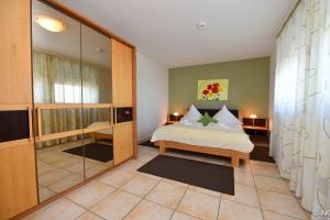 a bedroom with a bed and a glass wall at Haus "Panorama" Appartement PAN063 in Duhnen +31 photos