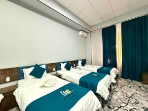 Katil atau katil-katil dalam bilik di Amor Fati hotel and Game club