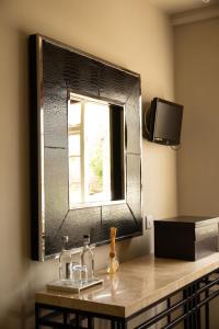 a bathroom sink with a mirror and a window at The Greenman Fownhope Hereford in Fownhope +47 photos