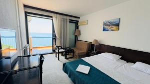 Postel nebo postele na pokoji v ubytování CORPUS A - Hotel Albatros