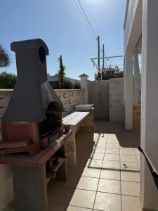 a brick oven sitting on top of a patio at Villa Oliveto in San Pietro in Bevagna
