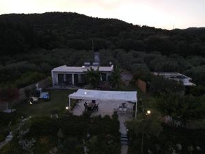 an aerial view of a house with a backyard at Azzure Heaven in Loutrá Elevtherón