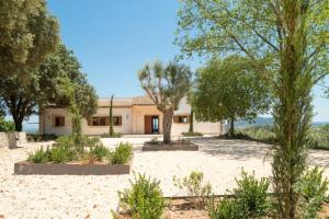 an exterior view of a house with trees at Modern 5 Bedroom Villa in Selva, 1455 in Selva