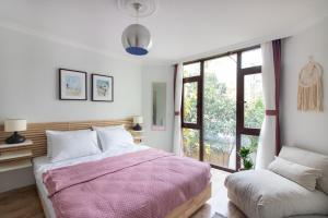 a bedroom with a large bed and a window at 3BR Villa with Garden & Terrace in Kadikoy in Istanbul