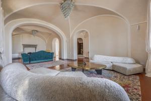 a living room with two couches and a table at Villa Leonardo - Vinci in Vinci