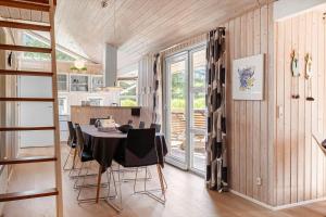 a kitchen and dining room with a table and chairs at 233-Thisted-Tunvej-5 in Thisted