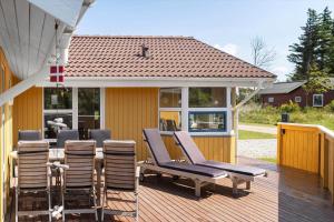 a deck with chairs and a table on a house at 233-Thisted-Tunvej-5 in Thisted