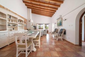 a dining room with a table and chairs at Finca Kelly in Artá