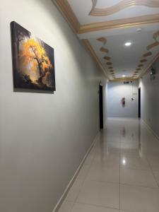 a hallway in a building with a painting on the wall at ودان المتميزة in Rabigh