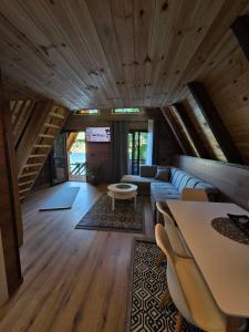 a living room with a couch and a table at Visitor Place in Plav