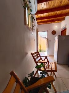 a living room with two chairs and a refrigerator at Light House studio in Dahab +4 photos