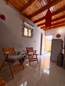 a living room with chairs and a table and a window at Light House studio in Dahab