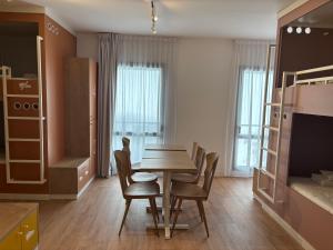 a dining room with a table and chairs at Apparthotel Privilodges Toulon Centre Gare in Toulon