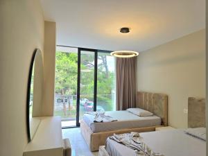 Un pat sau paturi într-o cameră la Villa Gardenia 2