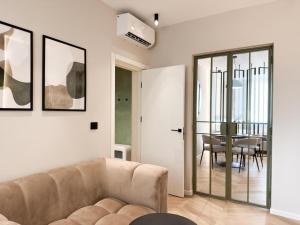 a living room with a couch and a table at Bussiness Loft Oldcity in Iaşi