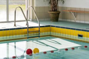 a swimming pool with balls in the water at 254-Vestervig-Havnevej-1-lejl-4 in Vestervig