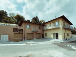 a building on the side of a street at Fiore di Langa - Residence in Monforte d'Alba in Monforte dʼAlba