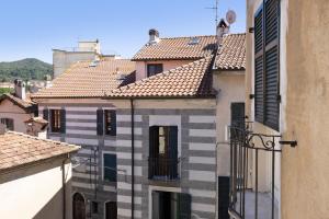 a group of buildings in a city with roofs at I Portici Holiday Home in Cairo Montenotte