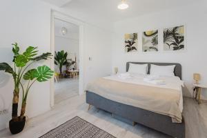 Ένα ή περισσότερα κρεβάτια σε δωμάτιο στο City Center Accomodation - 101