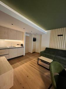 Η κουζίνα ή μικρή κουζίνα στο Rauzi apartments