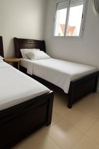 Postel nebo postele na pokoji v ubytování Lolla home