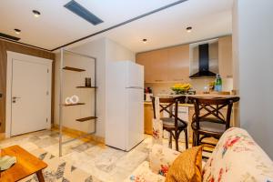 a kitchen and a living room with a couch and a table at Istanbul Apartments in Istanbul