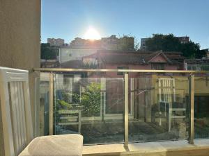a balcony with a view of a house at dorian beach appartment 4 in Durrës