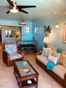 a living room with two couches and a table at C206 - Sapphire Beach - Sapphire Jewel VI in East End