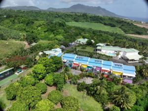 an aerial view of a resort with trees and buildings at Résidence Paradis Tropical in Basse-Terre