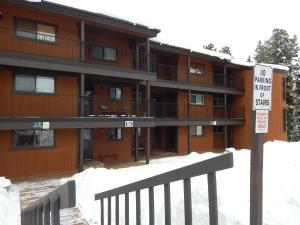 a no parking sign in front of a building at Beaver Village Unit #0621 in Winter Park