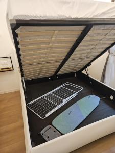 a bottom bunk of a bunk bed with a cell phone at Villa Joy Verona - Lovely Suite in Verona +26 photos