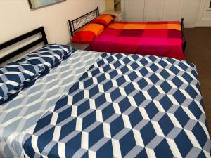two beds sitting next to each other in a bedroom at Room in New York in Jackson Heights