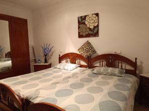 a bedroom with a large bed with two pillows on it at The terraces in Bácor +29 photos