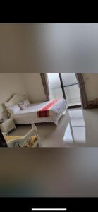 a small bedroom with a bed in a room at Shanhai B&B in Jinning