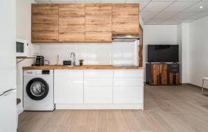 a kitchen with white cabinets and a dishwasher at 1 Bedroom Stunning Apartment In Grao De Castellon in Grao de Castellón