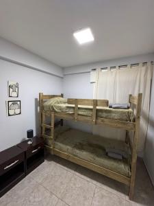 a room with two bunk beds in it at Departamento Turistico Liro in Santa Lucía