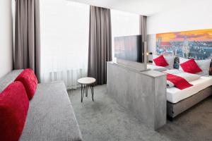 Postel nebo postele na pokoji v ubytování Rimedya Hotel - an der Messe München