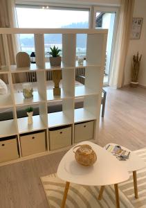 a room with white shelves and a table at Apartment Panoramablick in Bad Mergentheim