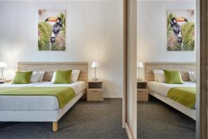 Postel nebo postele na pokoji v ubytování Hôtel Marso