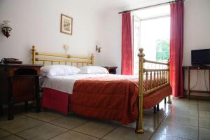 a bedroom with a bed and a window at Affittacamere Maison Napoleon in Turin