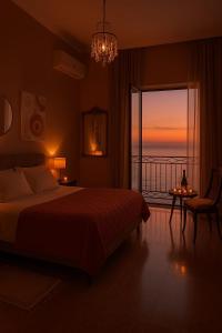 a bedroom with a bed and a view of the ocean at Sagittarius B&B in Cetraro