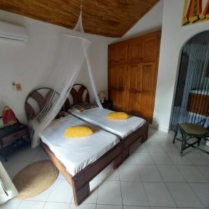 Postel nebo postele na pokoji v ubytování Villa Type Africaine