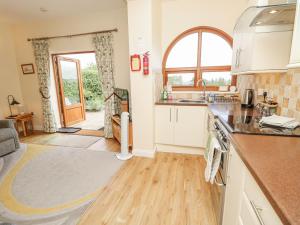 a kitchen with a sink and a counter top at 2 The Stables in Haven Street