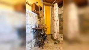 a kitchen with a table in the corner of a room at Modern Apartment Betina 45 m² + sea view in Betina +19 photos