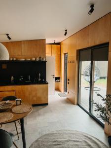 an open kitchen with a table and a dining room at Tysha in Tatariv +31 photos