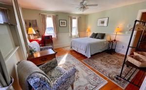 a bedroom with a bed and a living room at Jamaicahaus in Jamaica