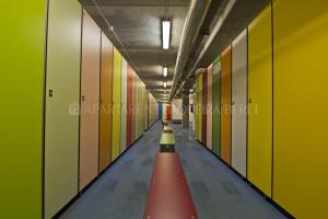 a long hallway with a red lane in a building at Apartarent 1500 - Apartamento Gamo in Baqueira-Beret